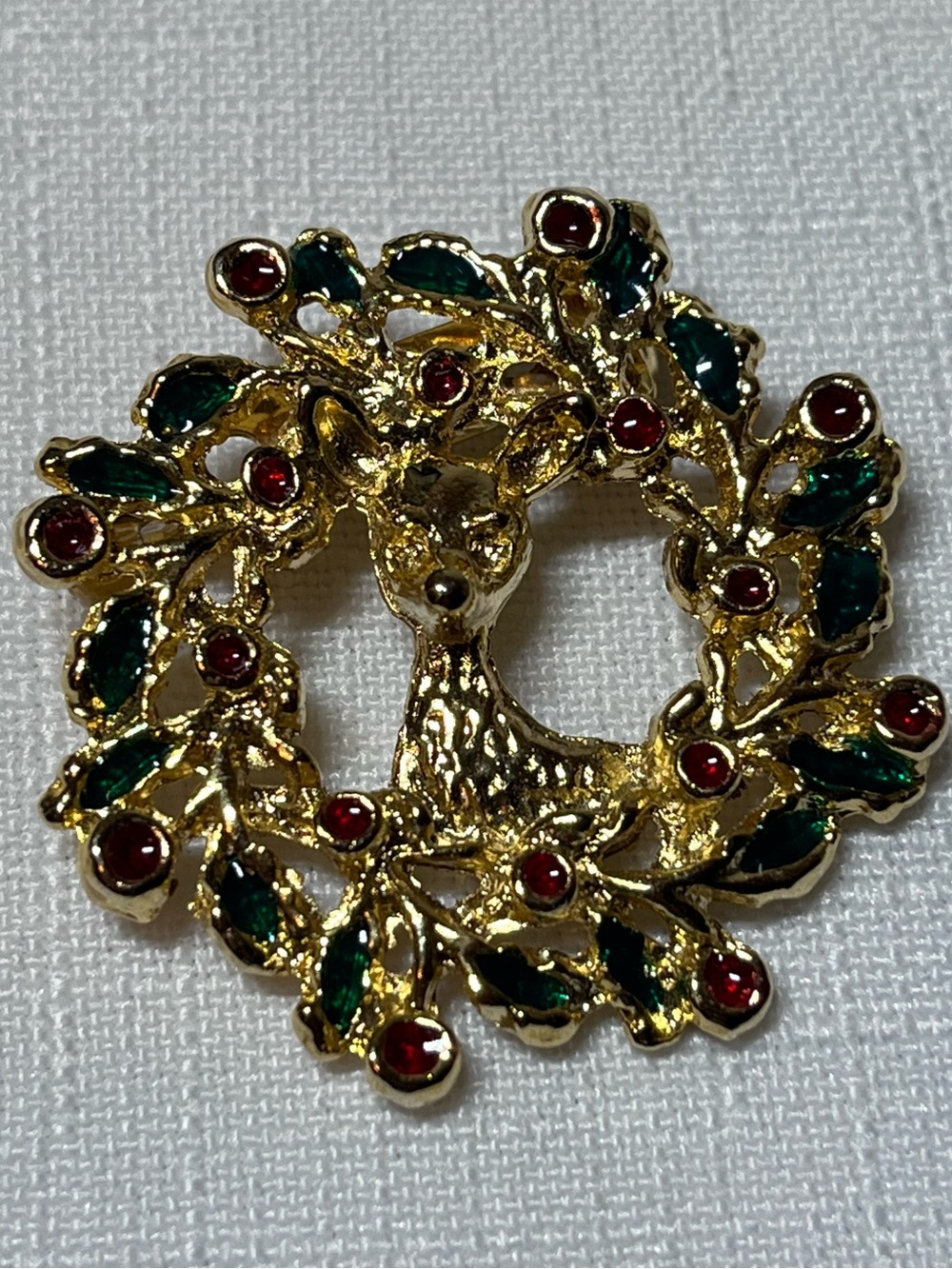 Vintage Gold Brooch with Green Leaves and Red Accents
Christmas
